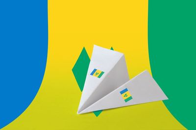 Close-up of yellow papers against blue background