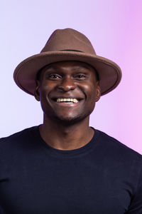 Portrait of man wearing hat against sky