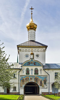 Low angle view of church and building against sky