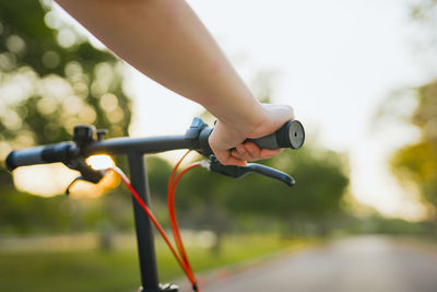 Spring is comming concept with closeup woman hand hold on bicycle