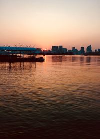 Scenic view of sea against clear sky during sunset