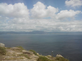 Scenic view of landscape against cloudy sky