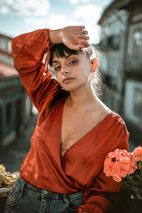 Portrait of young woman standing outdoors