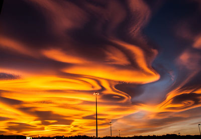 Low angle view of dramatic sky during sunset