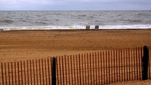 Scenic view of beach and sea against sky