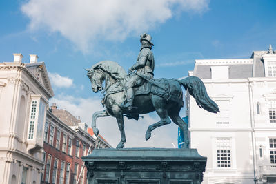 Low angle view of statue against sky