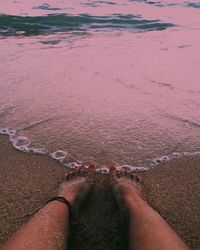 Low section of woman at beach