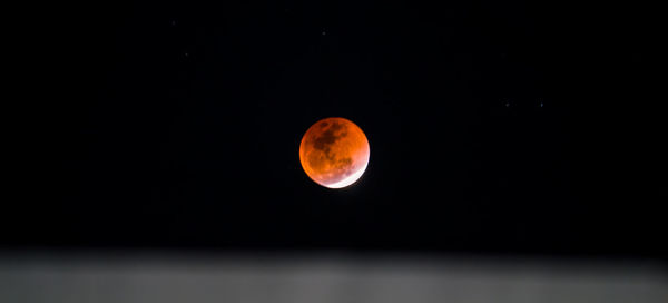 Scenic view of moon against sky at night