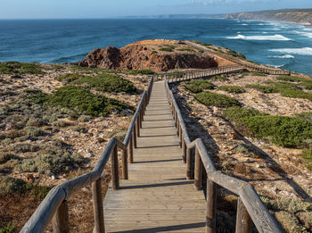 The evening sun shining onto the boardwalks at bordeira on the algarve in portugal