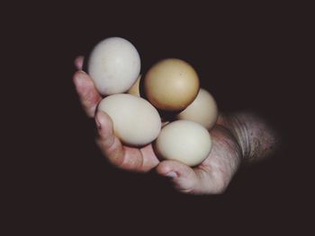 Close-up of hands over black background