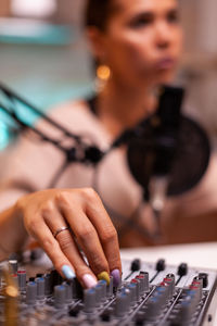 Side view of young woman working at home