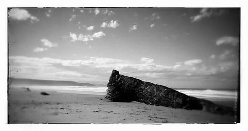 Scenic view of sea against cloudy sky
