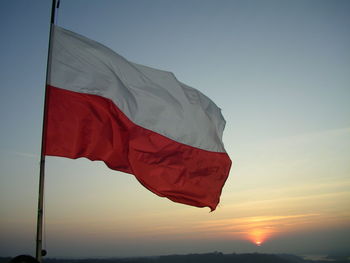 Low angle view of flag against sky