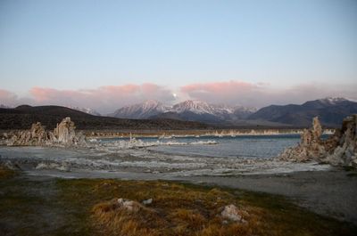 Rock formation in mono lake by mountain