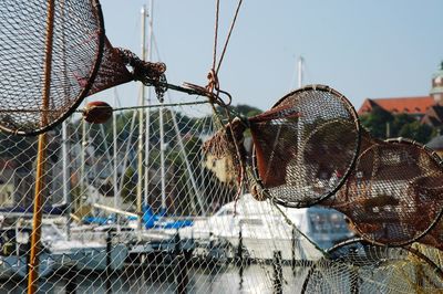 Close-up of fishing net against sky