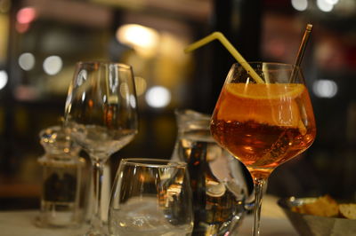 Close-up of wine glasses on table