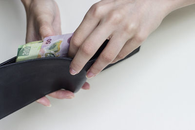 Midsection of woman holding hands