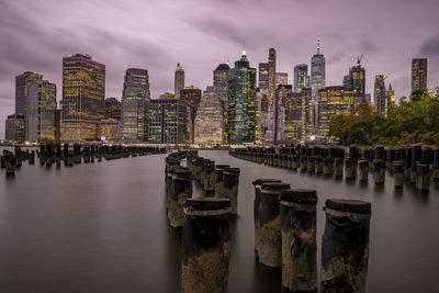 Panoramic view of river amidst buildings against sky