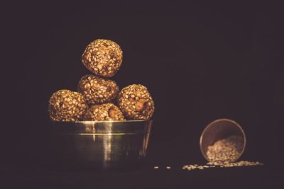 High angle view of candies on table against black background