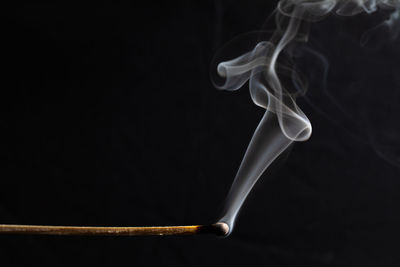 Close-up of smoke against black background