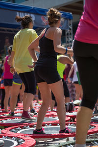 Rear view of people walking outdoors