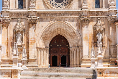 The staircase and entrance of the monastery church of the mosteiro de alcobaca, portugal