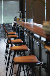 Empty chairs and table in caf�