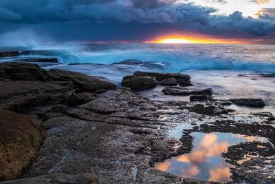 Scenic view of sea against sky during sunset