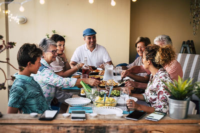 Cheerful family having dinner at home