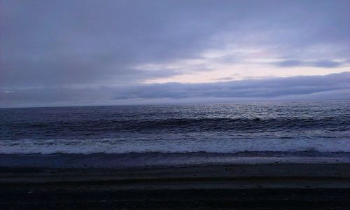 Scenic view of sea against sky at sunset