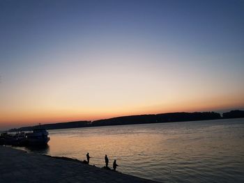 Scenic view of sea against clear sky during sunset