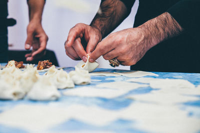 Mid section of a man preparing snacks