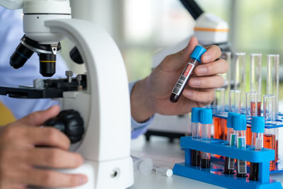 Cropped hand of scientist working in laboratory