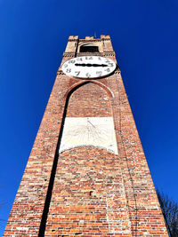 Low angle view of building against blue sky