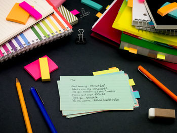 High angle view of text on paper at desk