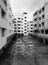 Street amidst buildings against sky