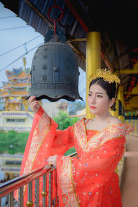 Woman looking away at temple