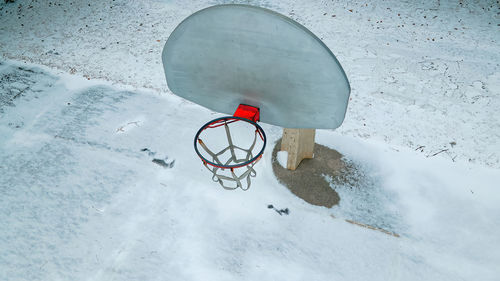 Old fashioned basketball hoop in winter 