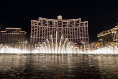 View of fountain building at night