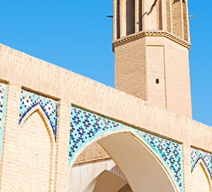 Low angle view of building against blue sky