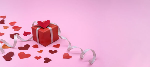 Close-up of heart shape made of pink flower in box