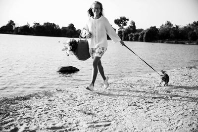 Full length of woman walking on beach