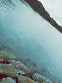 High angle view of sea shore against sky