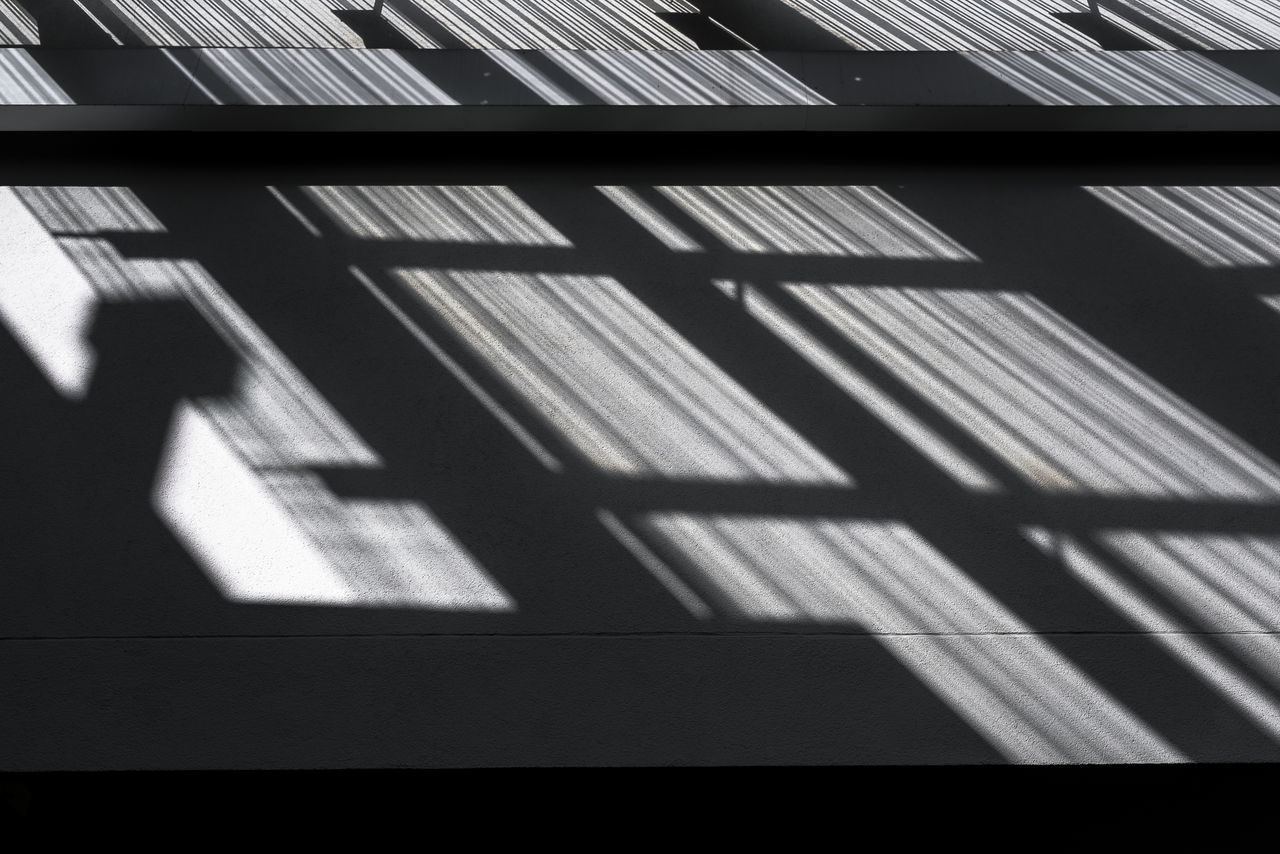 SHADOW OF WINDOW ON TILED WALL