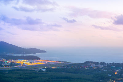 Aerial view of townscape against sky during sunset