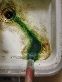 Close-up of hand on metal at home