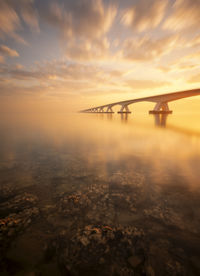 A beautiful sunrise at the zeeland bridge. the zeeland bridge is the longest bridge in zeeland.