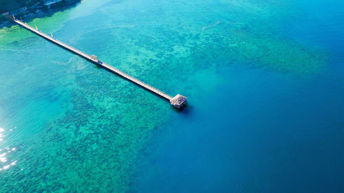 Aerial view of pier in sea