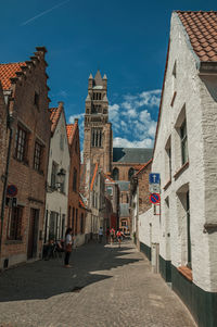 Brick facade of old houses and cathedral in bruges. a town full of canals in belgium.