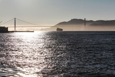View of suspension bridge over sea